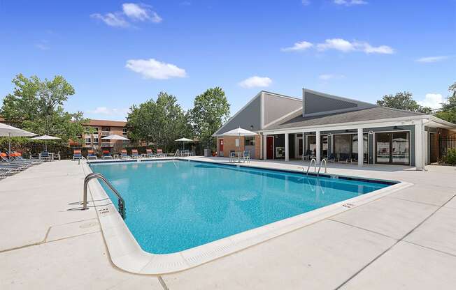 Swimming pool with lounge chairs on pool deck at Westwinds Apartments, Annapolis MD