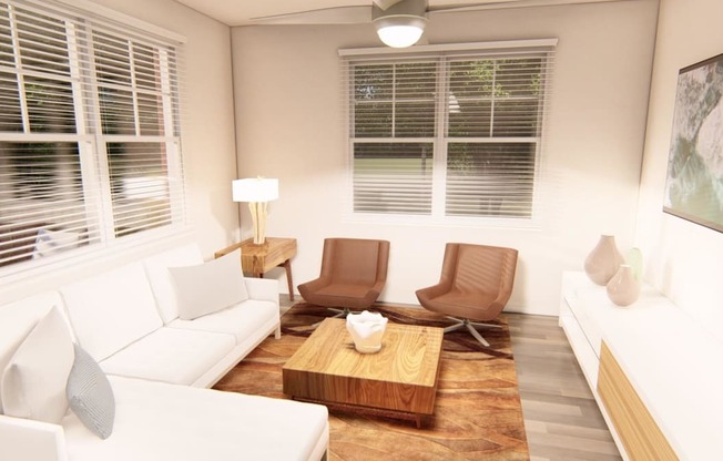 a living room with white couches and chairs and a wooden coffee table at Brownstones at Palisade Park, Colorado