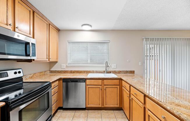 a kitchen with a stove top oven