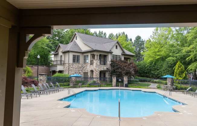 a swimming pool in front of a house