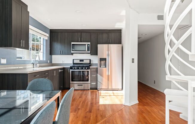 A 7 bedroom, 2 bathroom apartment with common areas and a fully functional kitchen at 10777 Ashton Ave. Unit 302