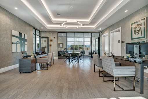 A modern office space with wooden floors and contemporary furniture.