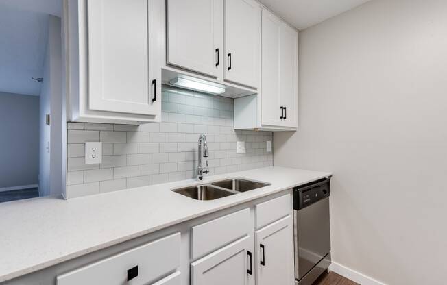 Kitchen with White Cabinetry and Subway Tile Backsplash