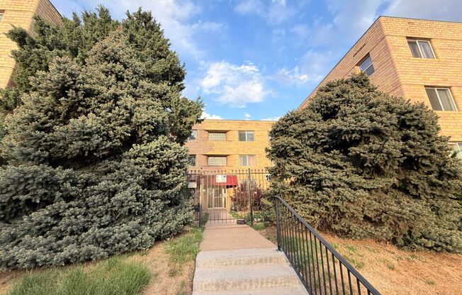 Turnkey Top-Floor Living in Gated Community Near City Park, Dining & Hospitals