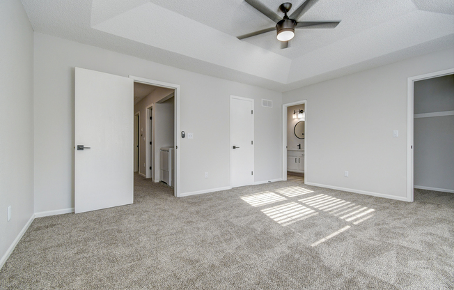 Empty townhome platinum bedroom doorways at The Arbor in Blue Springs, Missouri