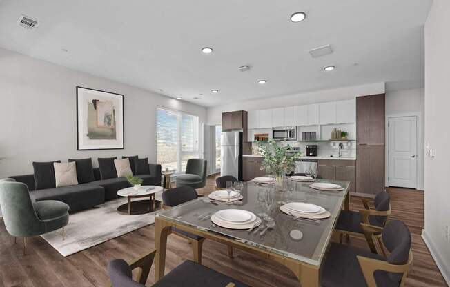 A modern dining room with a glass table and chairs.