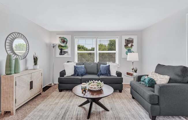 a living room with couches and a coffee table