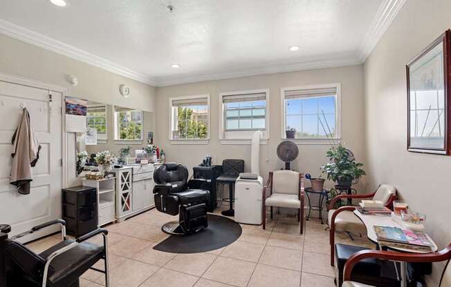 A hair salon with styling stations at Encore at Buckingham Apartments in Richardson, TX