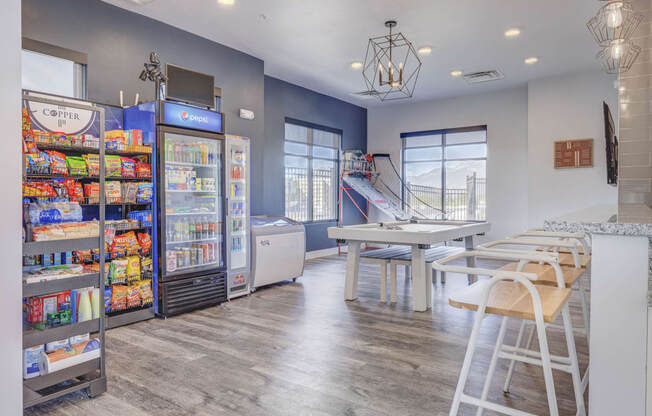 a room with a table and chairs and a vending machine at Copper 87, West Jordan, UT 84088