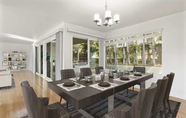 a dining room with a long wooden table and chairs