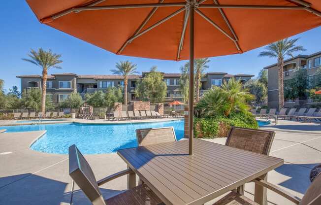 Poolside Dining Table at The Passage Apartments by Picerne, Henderson, NV