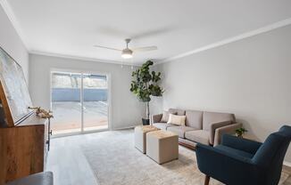 an apartment living area with model furnishings and lots of natural light at Mountainside Apartments