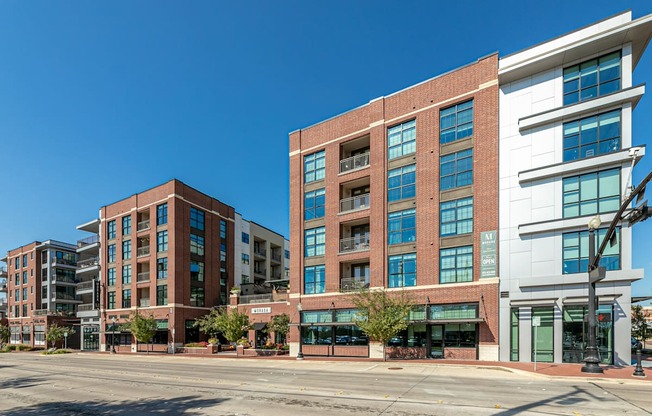 A large building with a lot of windows is in the foreground.