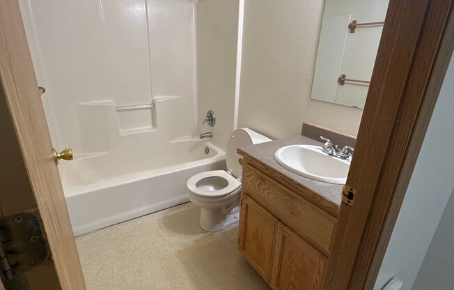 Townhouse Close to COCC! All Appliances, W/D Hook-up, Attached Garage, Water/Sewer paid!