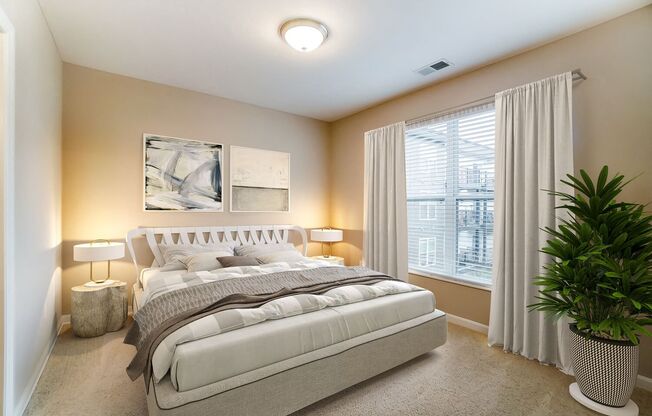 a bedroom with a bed and a potted plant