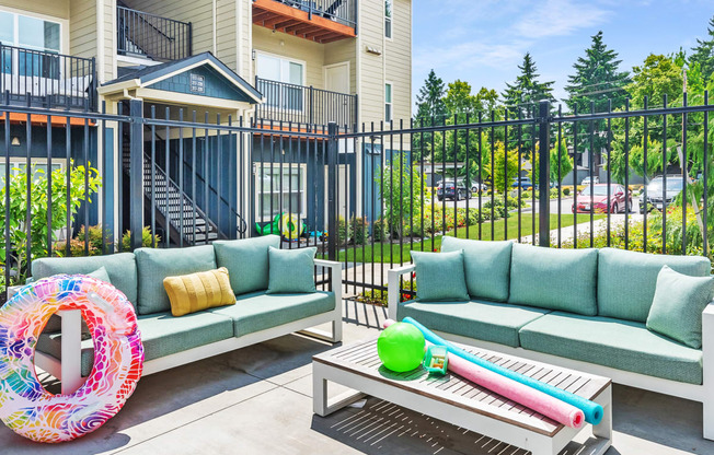 the preserve at ballantyne commons apartment patio with couches and tables