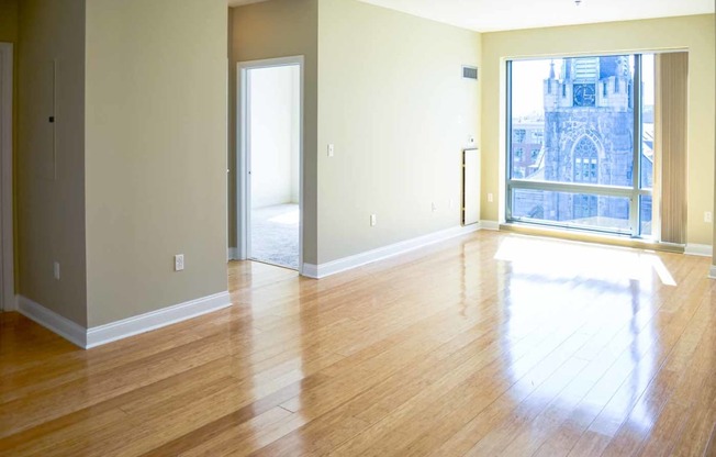 50 West broadway 2 bedroom apartment with hard wood flooring and large open windows with family living room