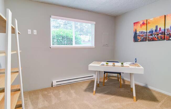 a bedroom with a bed and a desk in front of a window at The Bluffs at Mountain Park, Oregon