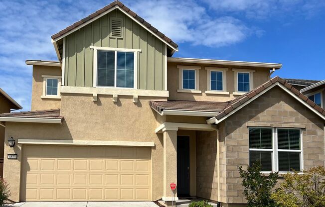 Beautiful two story home with SOLAR, NEW CARPET, PAINT, & LIGHT FIXTURES!