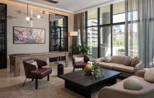 a living room filled with furniture and a large window