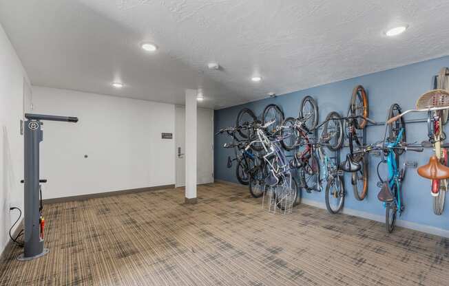 a room with bikes hanging on the wall