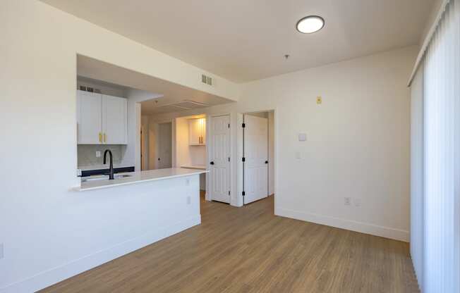 a kitchen and living room in an apartment