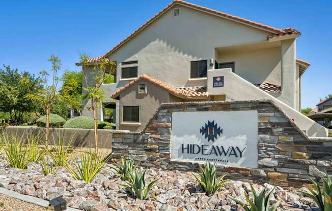 hideaway apartments entrance sign