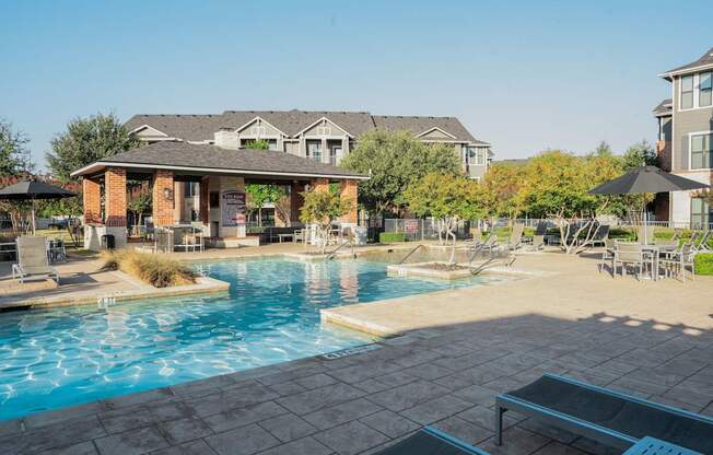 a swimming pool with a building in the background