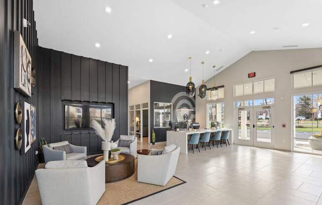 A spacious lobby with a reception desk and seating area.