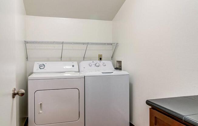 a washer and dryer in a room at The Bluffs at Mountain Park, Lake Oswego