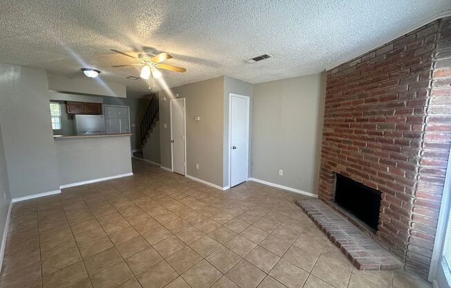 Two story unit with fireplace and backyard!