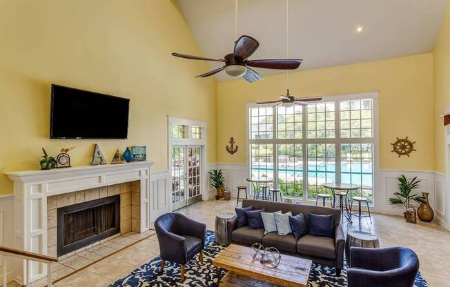 Fireplace and seating in Thoughtfully designed Resident Club House at Bay Crossings; Apartments In South Tampa