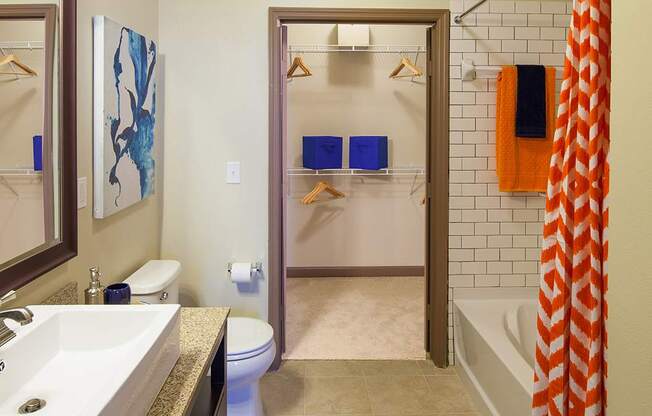 a bathroom with a toilet sink and bathtub