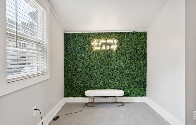 a living wall with a white bench in front of it at Linkhorn Bay Apartments, Virginia Beach, VA, 23451