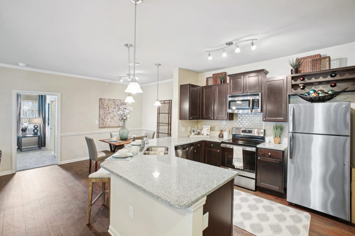 a kitchen with stainless steel appliances and granite counter tops