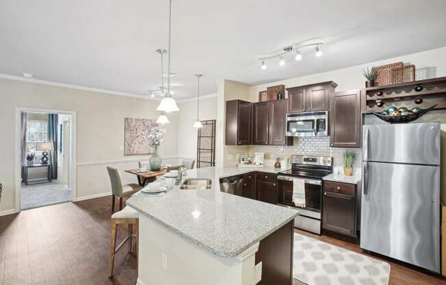 a kitchen with stainless steel appliances and granite counter tops