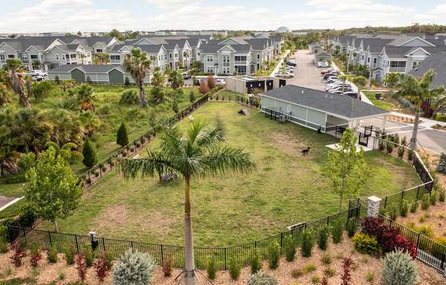 a park in the middle of a row of houses at Palm Grove in Ellenton, FL 34222