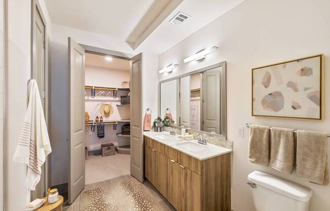 a bathroom with a sink and a toilet and a mirror