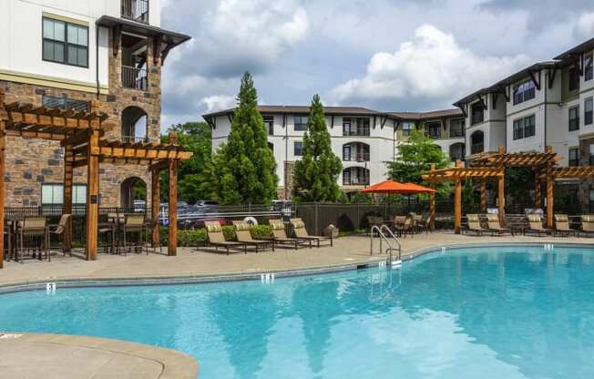 Resort-style Pool with covered seating at 4700 Colonnade Apartments in Birmingham, AL