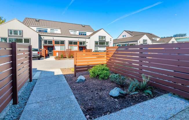 a wooden fence in front of a house