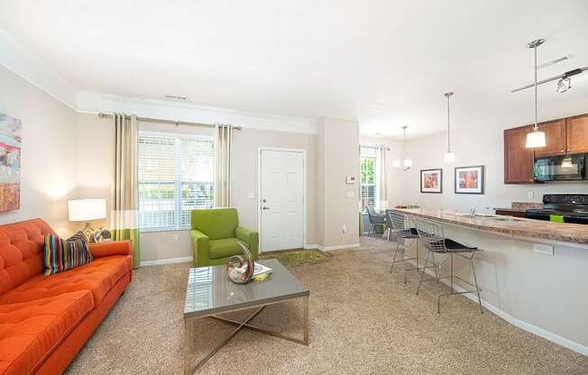 a living room with an orange couch