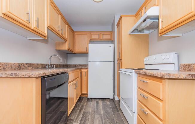 a kitchen with a stove and a refrigerator