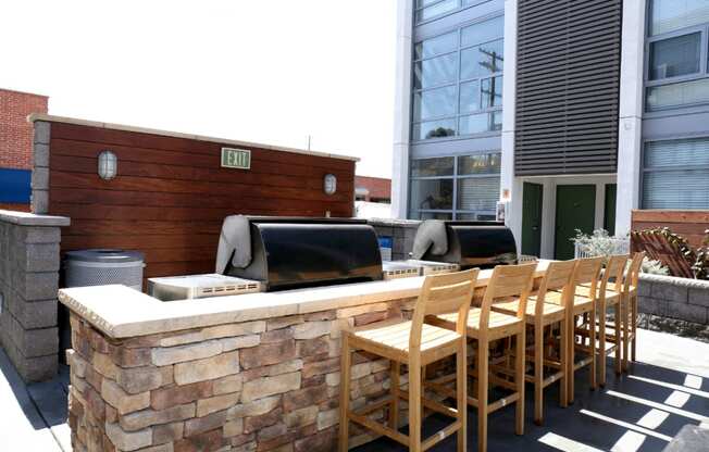 Community BBQ area with seating and counter
