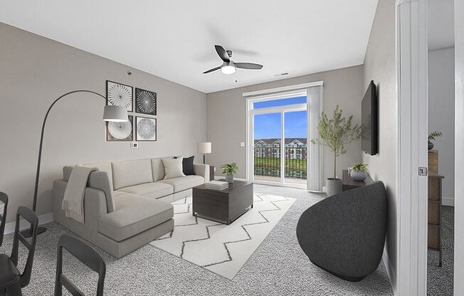 A modern living room with a grey sofa, a black chair, and a 9 foot ceiling at Trade Winds Apartment Homes, Elkhorn, Nebraska