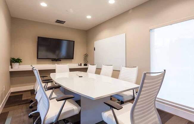 Campbell CA Apartments-Parc at Pruneyard Meeting Room with Round Conference Table and TV