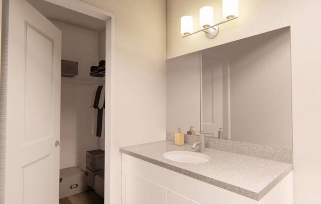 a bathroom with a sink and a mirror at Brownstones at Palisade Park Townhomes, Colorado, 80023