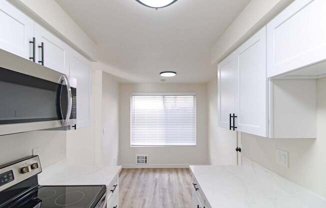 Renovated 2-bedroom kitchen with black range in Redmond, WA apartments