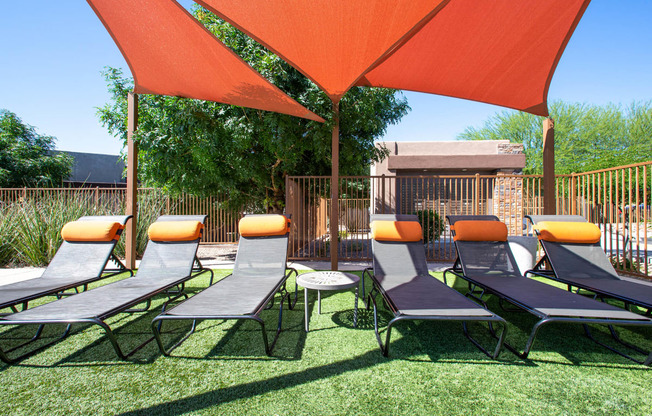 Resort pool seating at Sabino Vista Apartments in Tucson