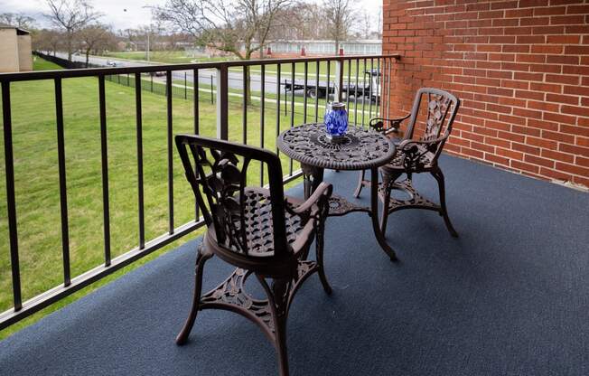 Balcony with two chairs at Rockdale Gardens Apartments*, Baltimore, MD