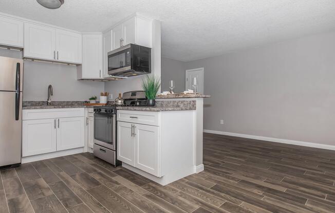 a kitchen with a wooden floor